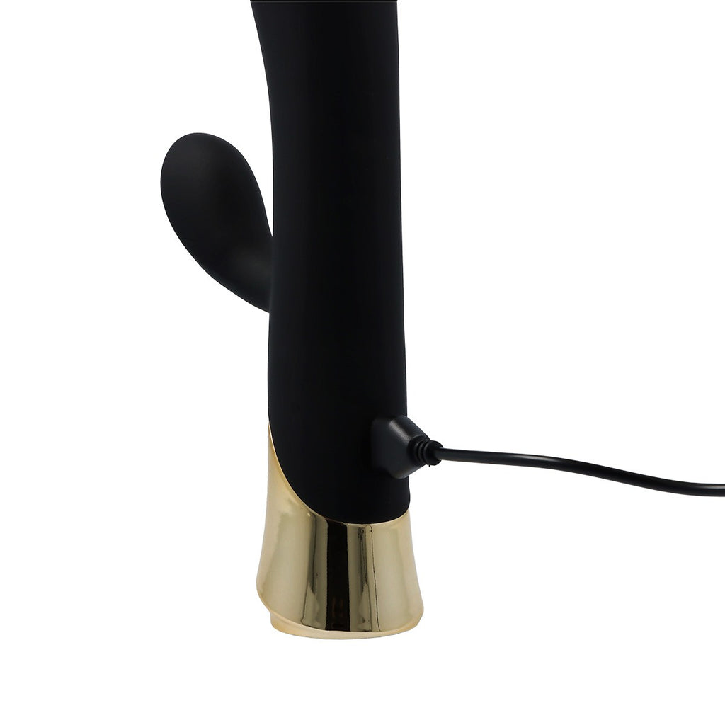 Vibratore ricaricabile in silicone color cannella con stimolatore vaginale e anale.